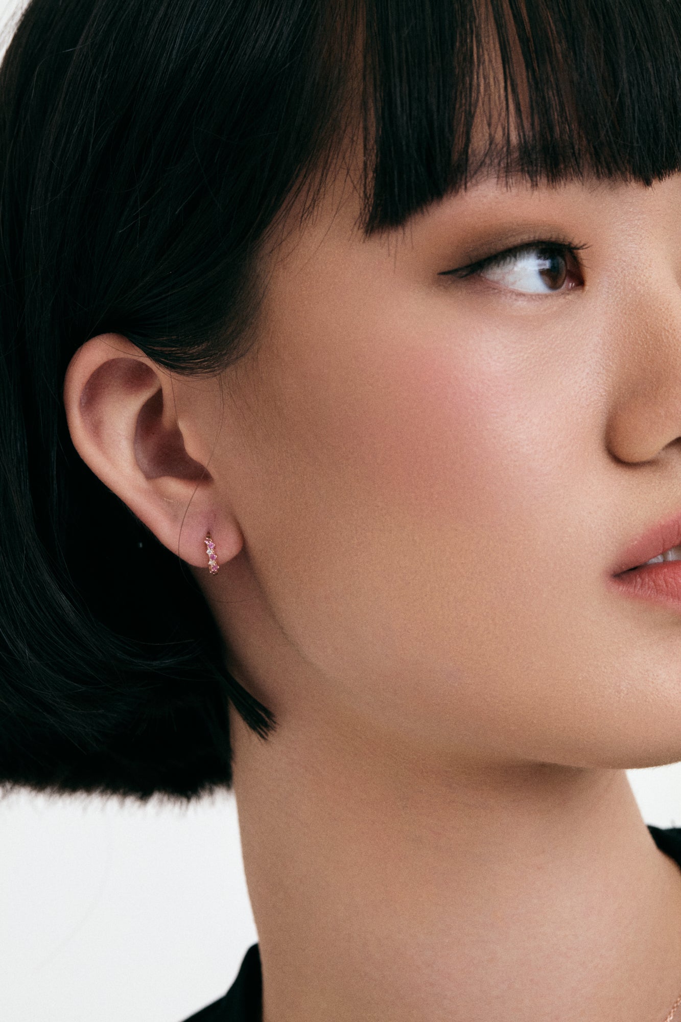 Interstellar 14K Solid Rose Gold Cluster Huggie Earrings on model