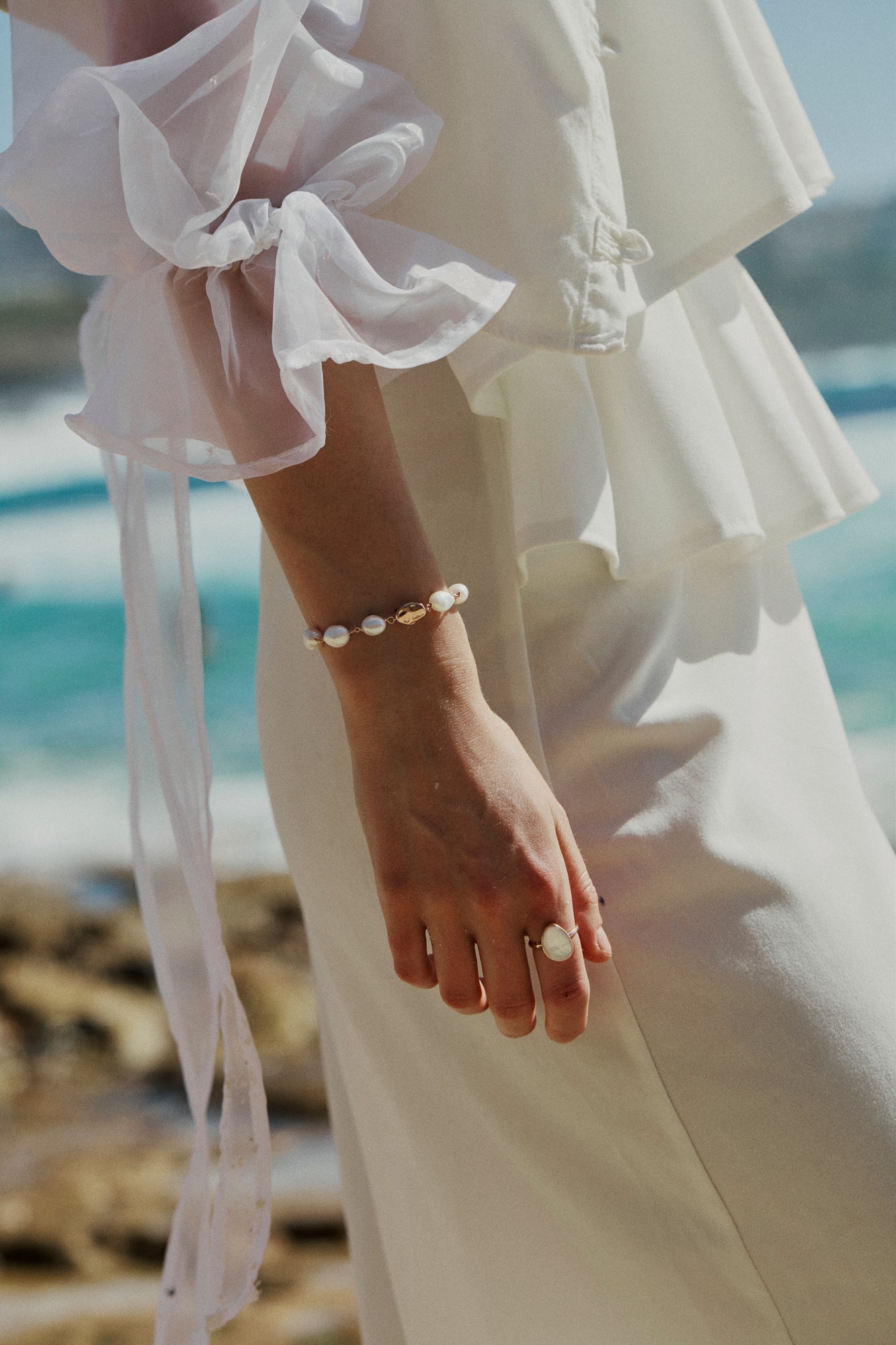 Small baroque pearl adjustable rose gold vermeil chain bracelet on model