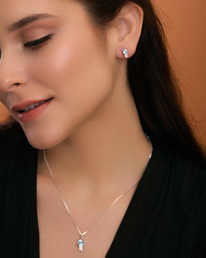 Sky blue topaz & white topaz star earrings on model