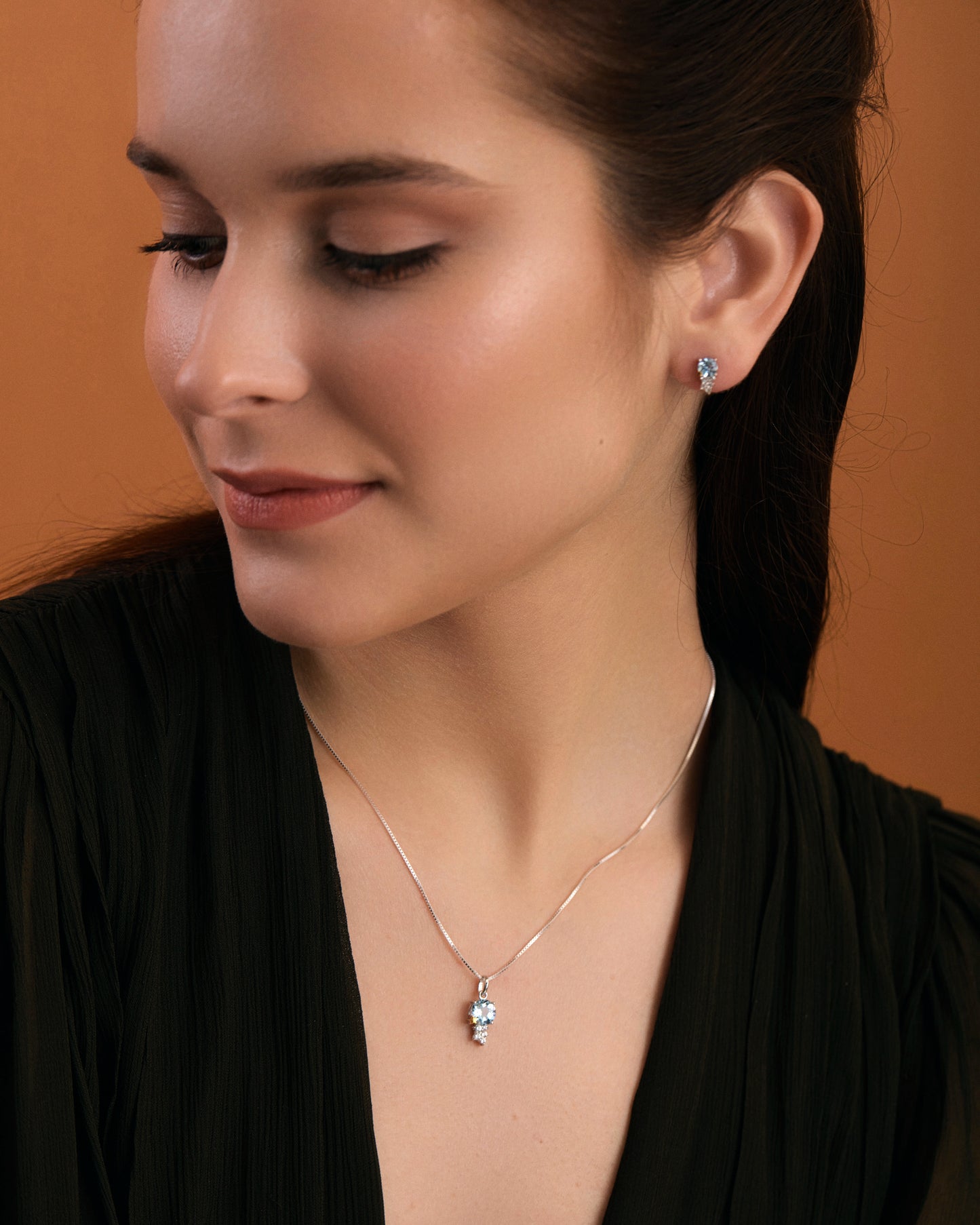 Sky blue topaz & white topaz star necklace on model