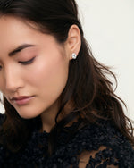 Aquamarine oval halo stud earrings on model