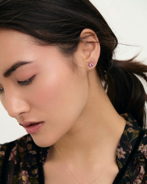 
                
                    Load image into Gallery viewer, Pink Amethyst petite star gemstone earrings on model
                
            