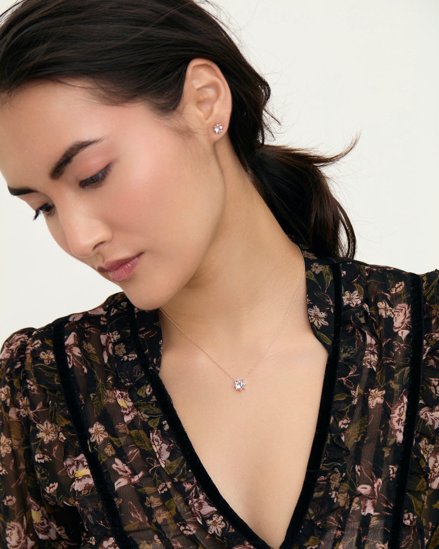 Sky blue topaz petite star gemstone necklace on model