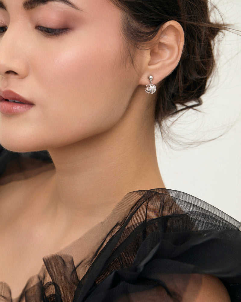 Dandelion sterling silver dangle stud earrings on model