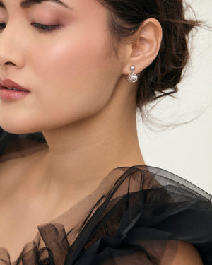 
                
                    Load image into Gallery viewer, Dandelion sterling silver dangle stud earrings on model
                
            