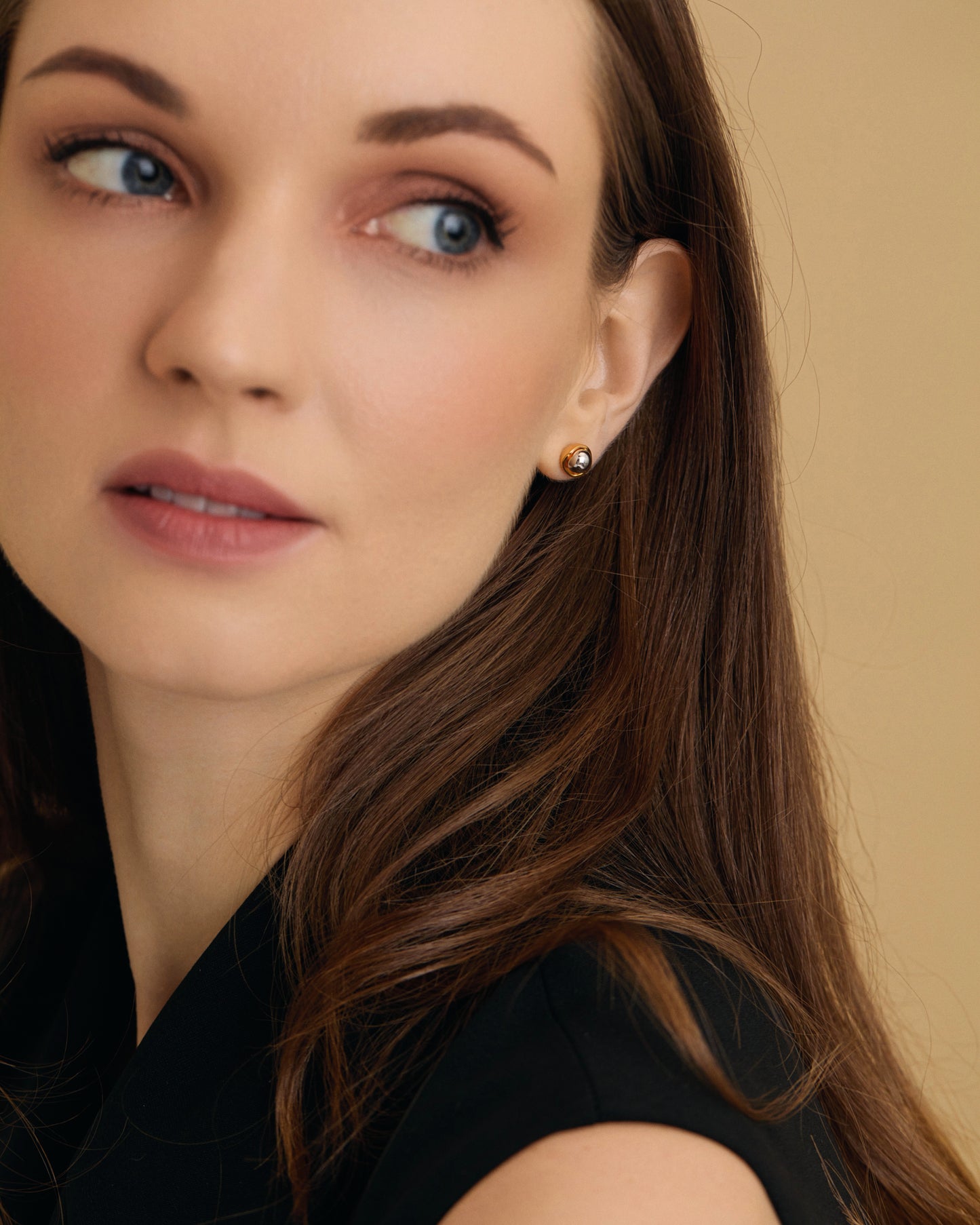 Seed inspired Two Tone Gold Silver Stud Earrings on model