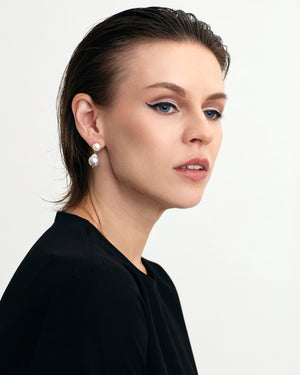 Contemporary styled fresh water pearl 18K gold vermeil dangle earrings on model