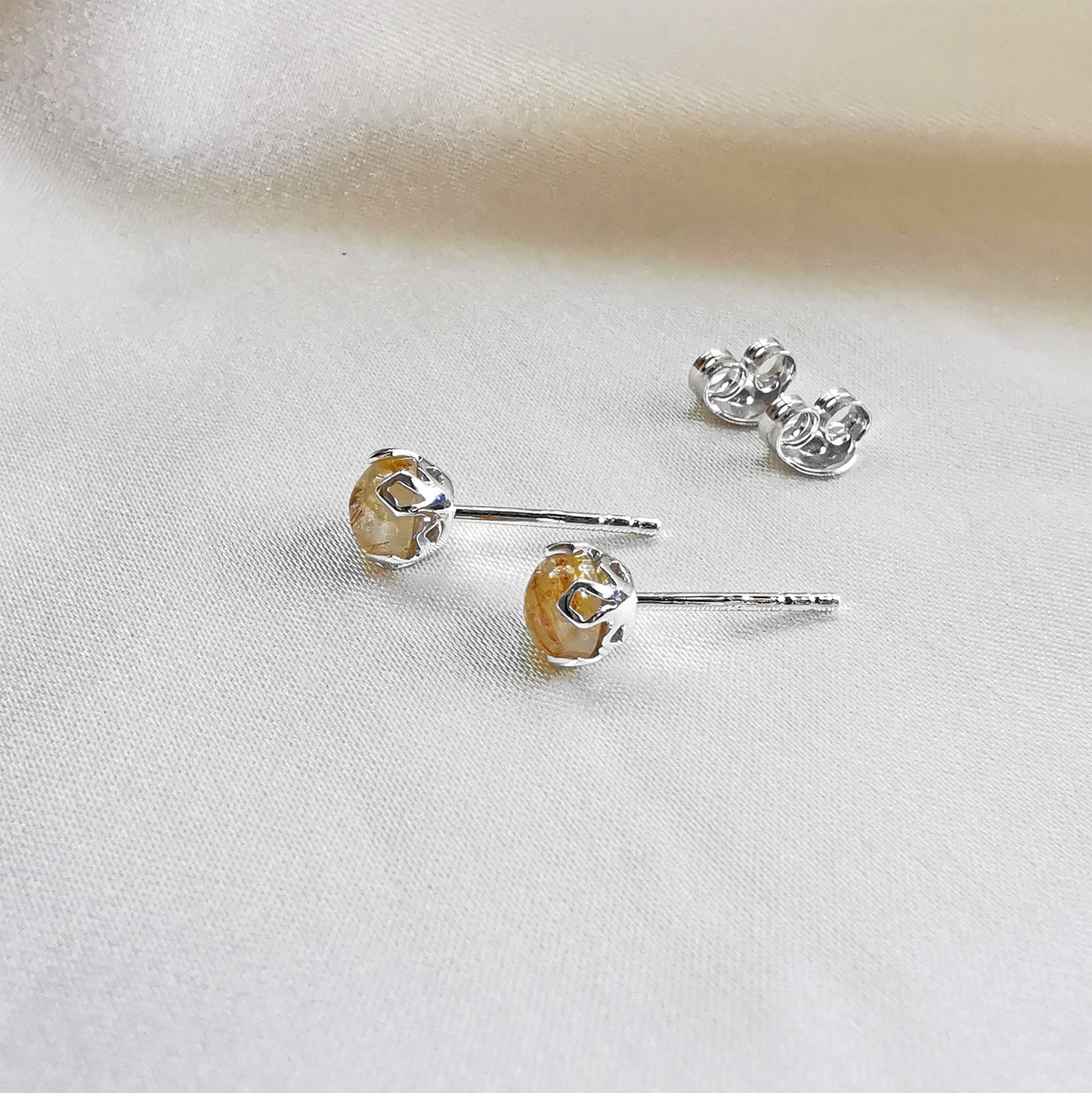 rhodium plated rutilated quartz round stud earrings